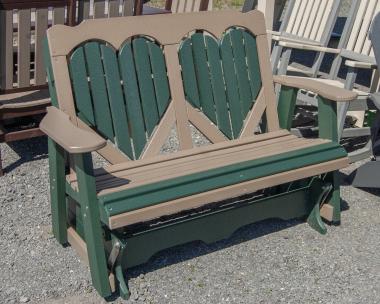 Four-foot poly glider with heart design in back slats in Turf Green and Weathered Wood colors